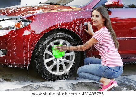 Foto stock: Woman Washing A Car