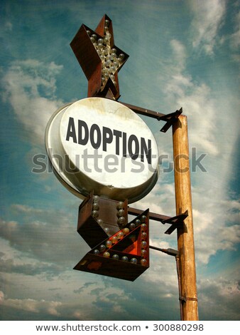 Foto stock: Adoption Word On Green Arrow