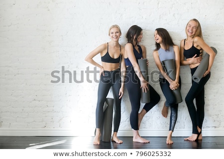 Foto stock: Smiling Woman In Sports Wear