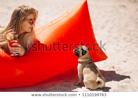 Stock photo: Pretty Smiling Woman In Sunglasses Holding Cocktail And Celebrating