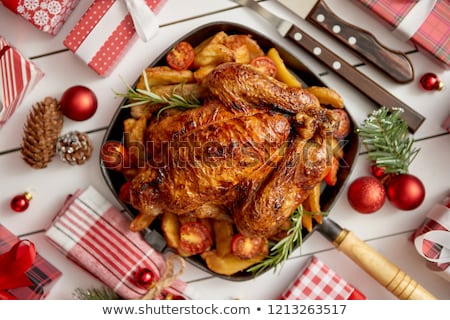 Stock photo: Roasted Whole Chicken Or Turkey Served In Iron Pan With Christmas Decoration