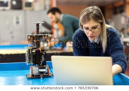 Zdjęcia stock: Young Technician Repairing Computer In Workshop