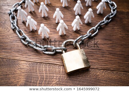 ストックフォト: Person Figures Surrounded By Chain And Lock