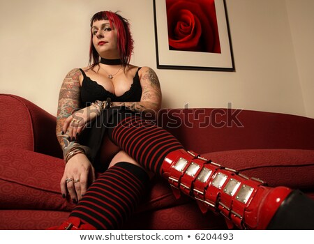 Stockfoto: Goth Girl On Red Couch