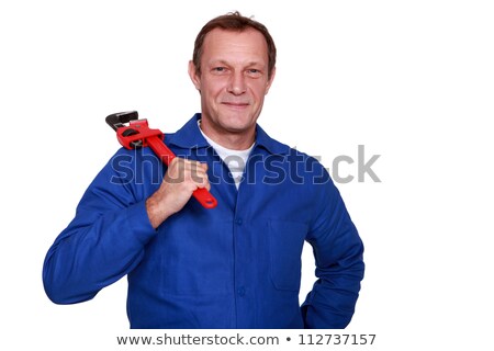 Stock photo: Portrait Of Mature Plumber Holding Adjustable Spanner