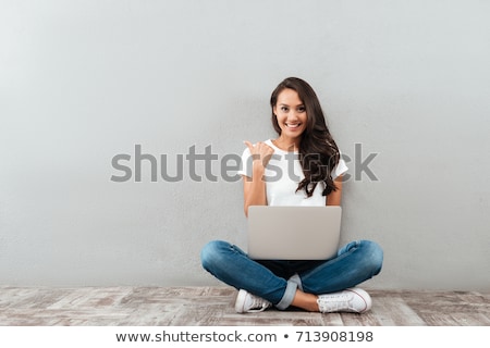 [[stock_photo]]: Casual Woman Sits With Laptop Points