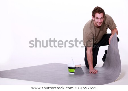 Stock photo: Man Laying Linoleum