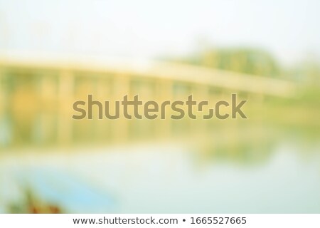 Foto stock: Buildings Over Green Landscape