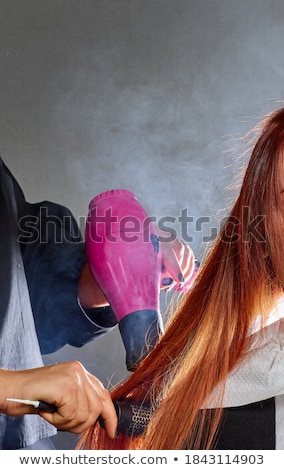 Stock photo: Hairdresser Cheat Hair In A Comb