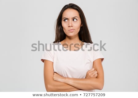 Foto d'archivio: Portrait Of An Irritated Woman On White Background