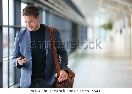 [[stock_photo]]: Ortrait · d'un · jeune · homme · d'affaires · à · l'aide · de · téléphone · mobile