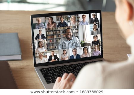 ストックフォト: Group Of Young Women With Laptop At Desk