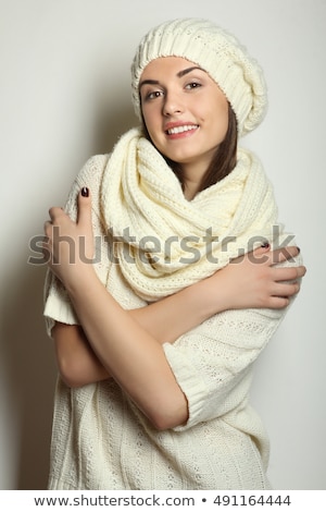 Foto stock: Smiling Brunette Woman Wearing Knitted Sweater