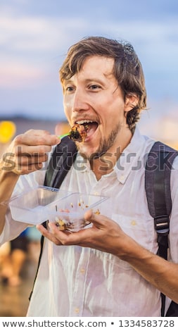 Zdjęcia stock: Young Man Tourist On Walking Street Asian Food Market Vertical Format For Instagram Mobile Story Or