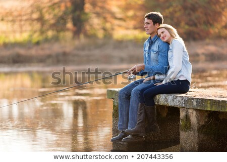Foto stock: Romantic Couple Fishing On The River