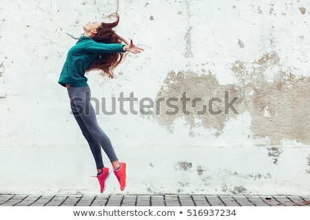 Foto stock: Young Urban Woman Jumping