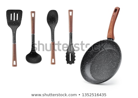 Foto stock: Pan With Black Plastic Kitchen Spatula