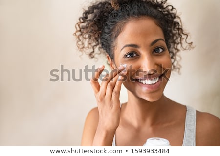 Stock photo: Portrait Of A Woman With Skin Care Looking At Camera