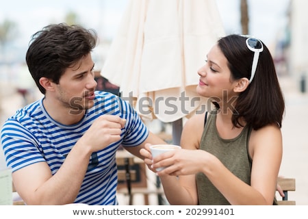 Stok fotoğraf: Man And Woman Sitting At A Cafe