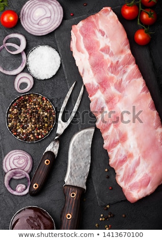 Stock photo: Fresh Raw Pork Ribs On Chopping Board And Vintage Meat Hatchets On Wooden Background Fresh Tomatoes