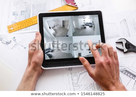 Сток-фото: Tablet With Tools And Grid Screen Concept