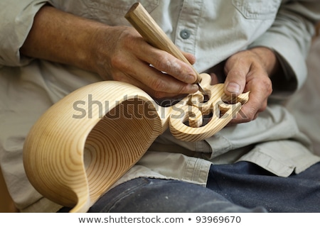 ストックフォト: Master Wood Carver Made Using A Special Knife Wooden National Dish - A Ladle With A Patterned Handle