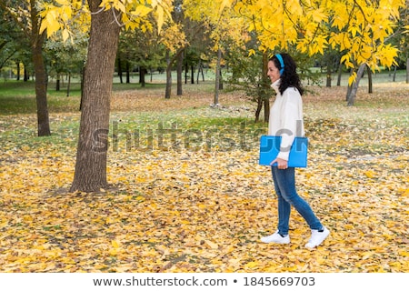 Stok fotoğraf: Portrait Of A Young Black Hair Woman In A Blue Wool Sweater