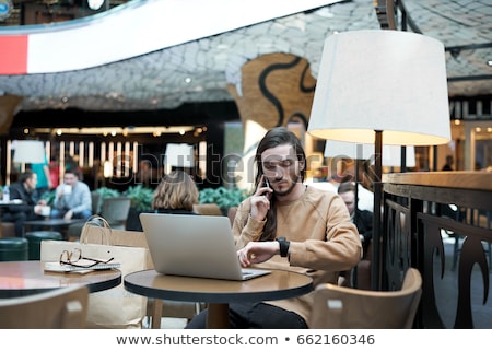 Stock fotó: Portrait Of Handsome Young Man Working With Laptop At Cafe At Bu