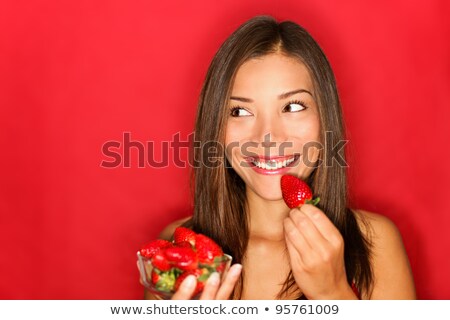 Asian Woman Eating Strawberries Stock fotó © Ariwasabi