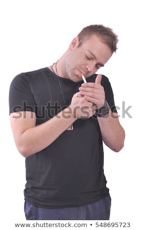 Zdjęcia stock: Casual Man Lighting His Cigarette