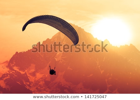 Stock foto: Sepia Paraglide Silhouette Over Alps Peaks