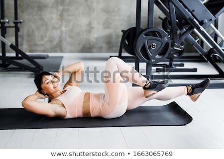 Stock foto: Athlete Woman With Perfect Fitness Body Performing Abdominal Exercises