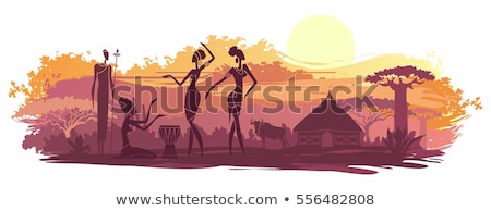 Foto stock: Woman In African Landscape At Sunset