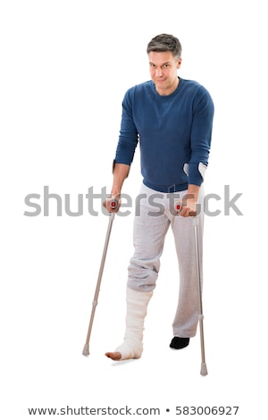 Stock fotó: Injured Man Walking On Crutches