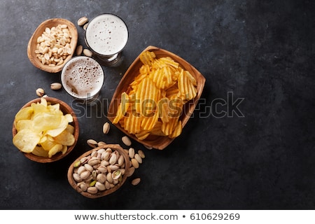 Foto stock: The Beer With Pistachios The Top View