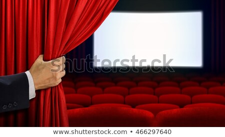ストックフォト: Hand Opening Curtain Before Movie Show