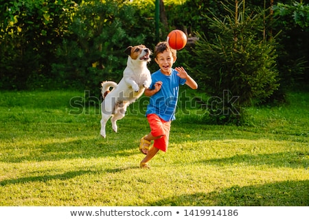 Stock fotó: Children Playing Ball Game In The Yard