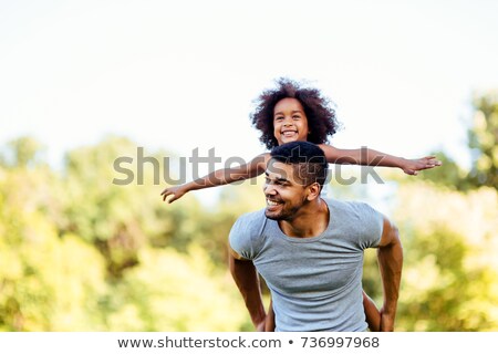 Stock foto: Father Carrying His Daughter Piggyback In Summer