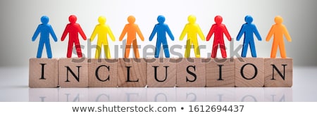 Stock photo: Human Figures Standing On Wooden Cubic Blocks