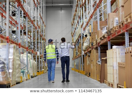 Zdjęcia stock: Businessman And Worker Walking Along Warehouse