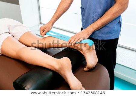 Foto stock: Male Foot With Physio Tape