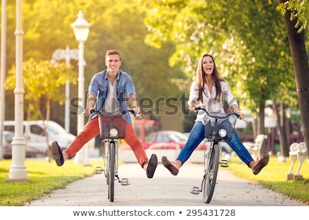 Stock photo: Young Beautiful Woman Riding A Bicycle In A Park Active People Outdoor