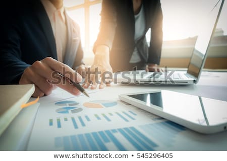 Stockfoto: Business Team Two Colleagues Discussing New Plan Financial Graph