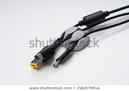 [[stock_photo]]: Organized Cable Holder On Table With Charging Cables