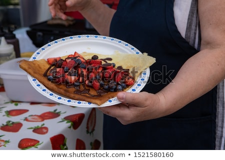 Stok fotoğraf: Freshly Prepared Crepes With Blueberries Chocolate Sauce