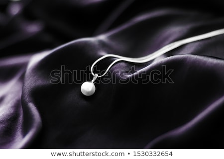 Stockfoto: Luxury White Gold Pearl Necklace On Dark Violet Silk Background