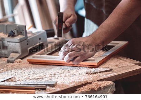 Imagine de stoc: Carpenter Making A Frame