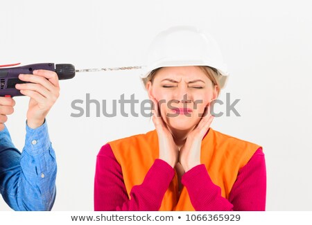 Stock fotó: A Scared Female Construction Worker With A Drill