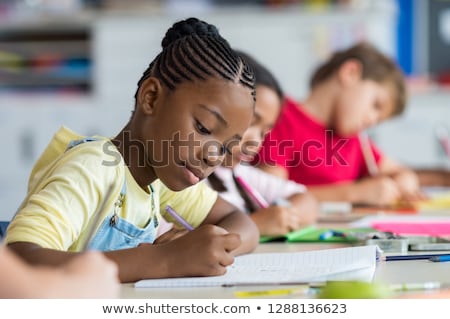 Stok fotoğraf: Young Child At Writing Desk