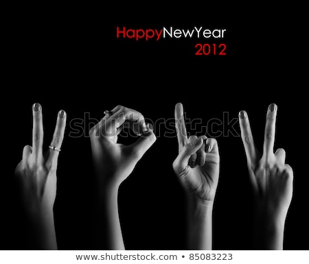 Foto stock: The Number 2012 Are Shown Via Fingers In Creative New Year Greet